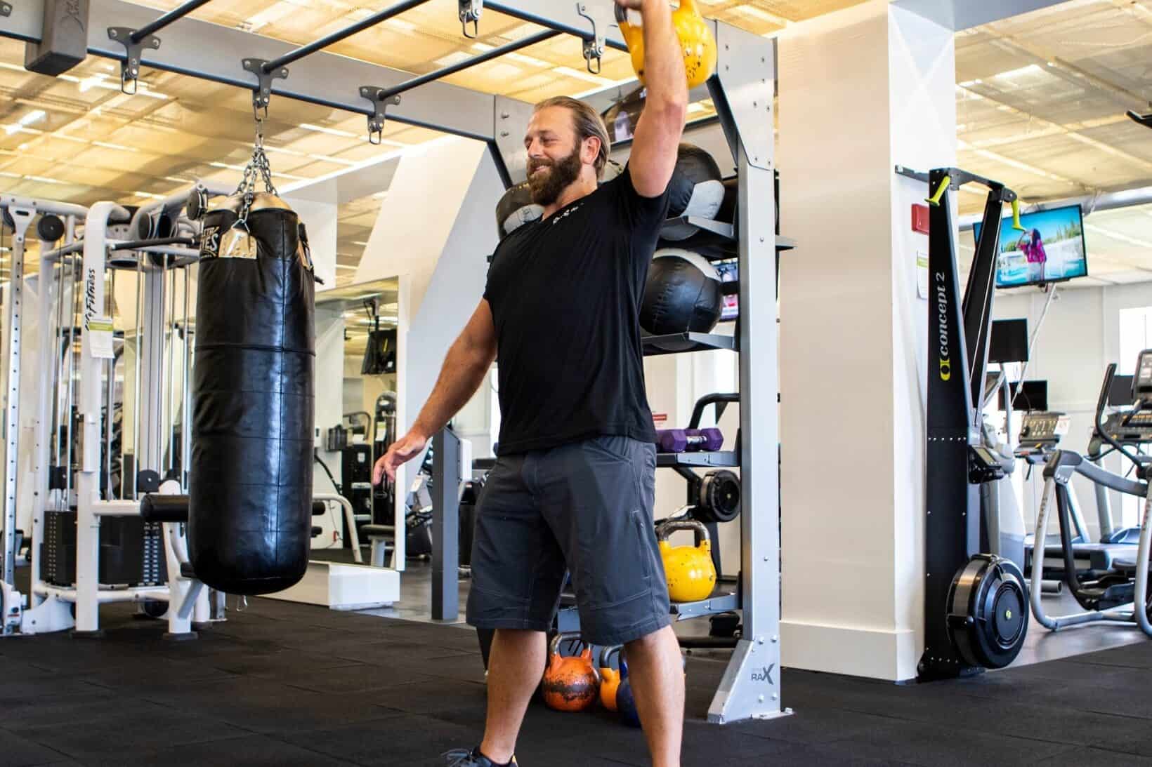Man working out with weights in gym