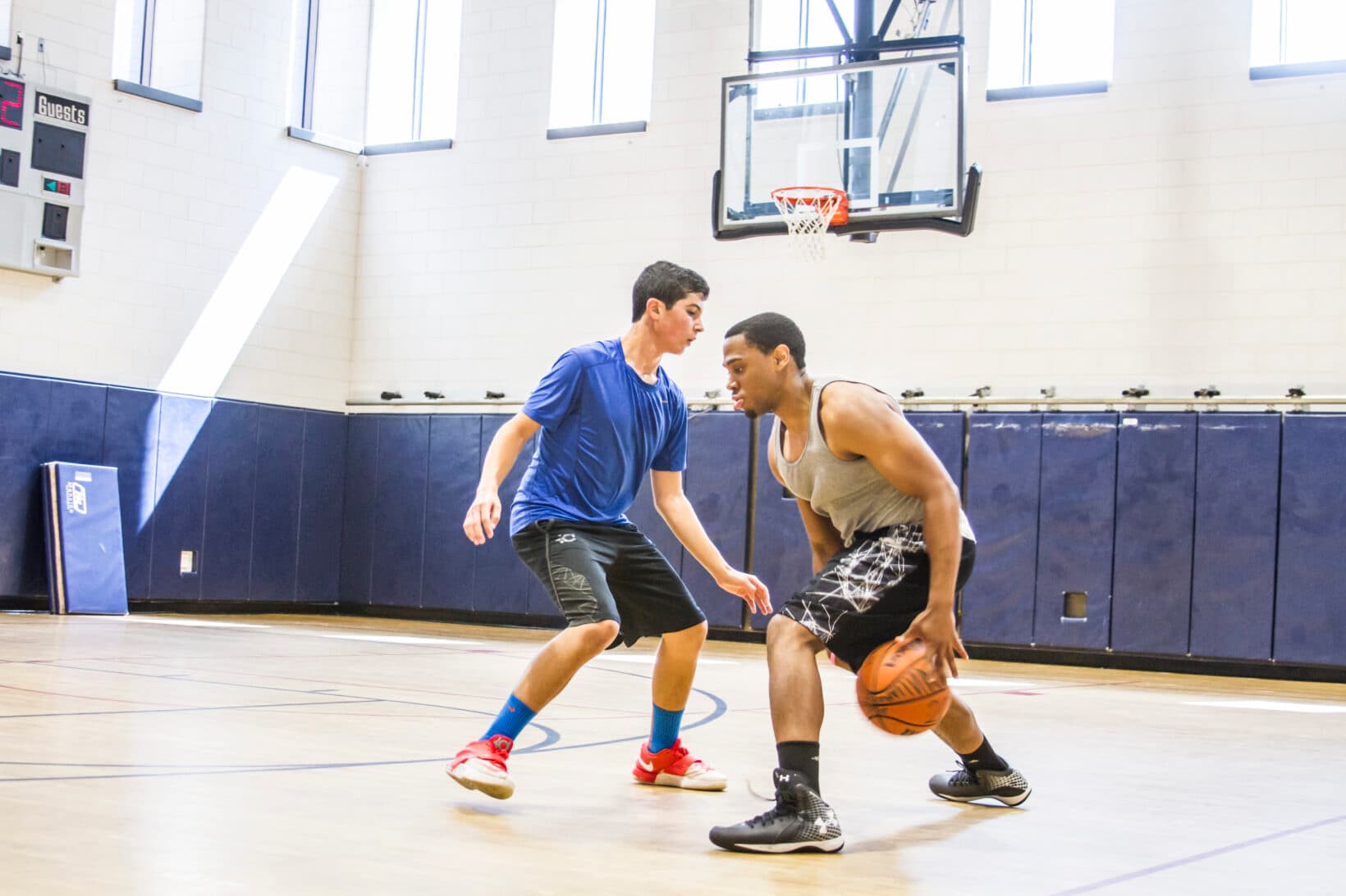 Two men playing basketball