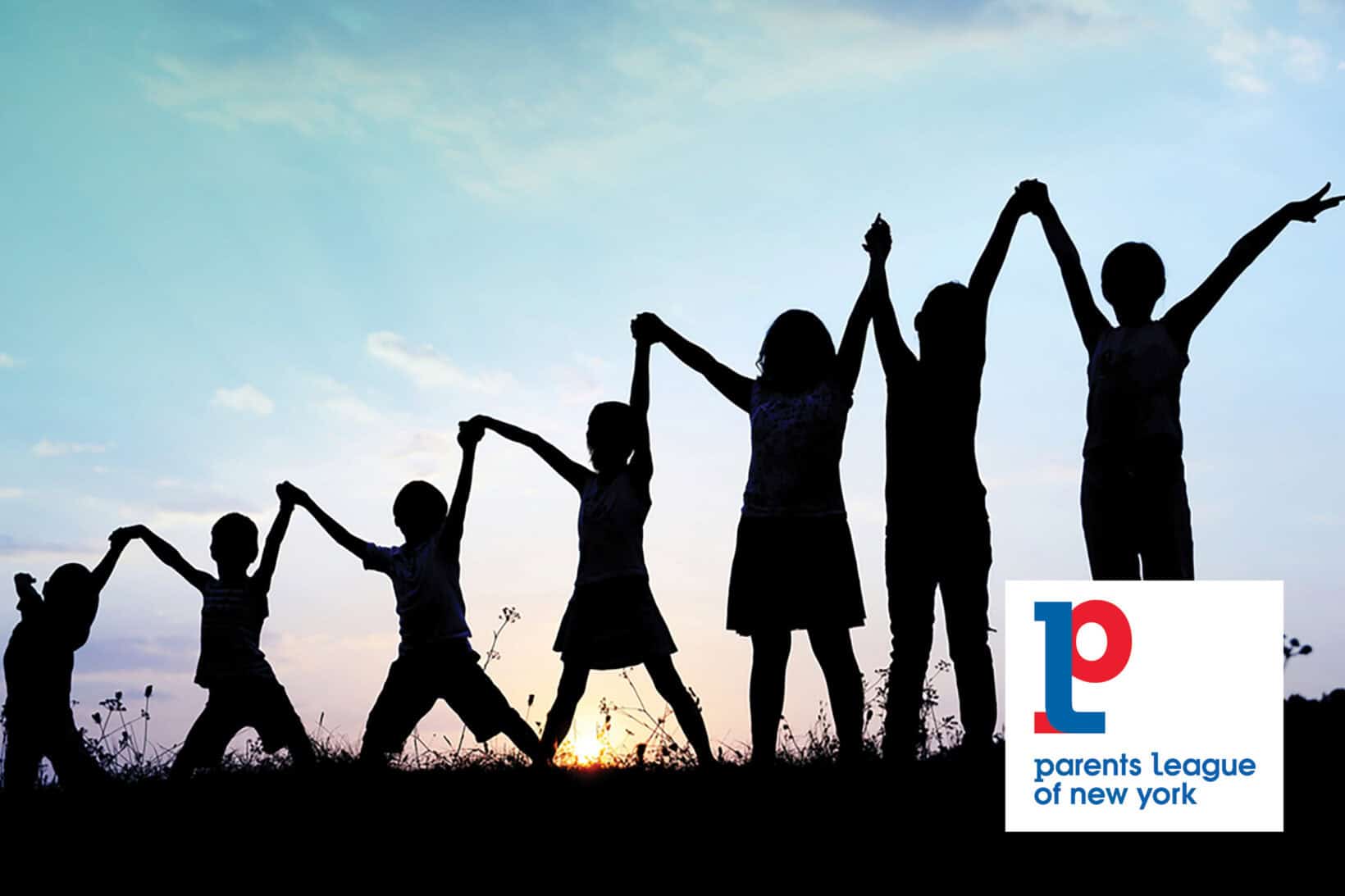 Children standing in a field with sun setting in the background holding hands with the Parents League logo